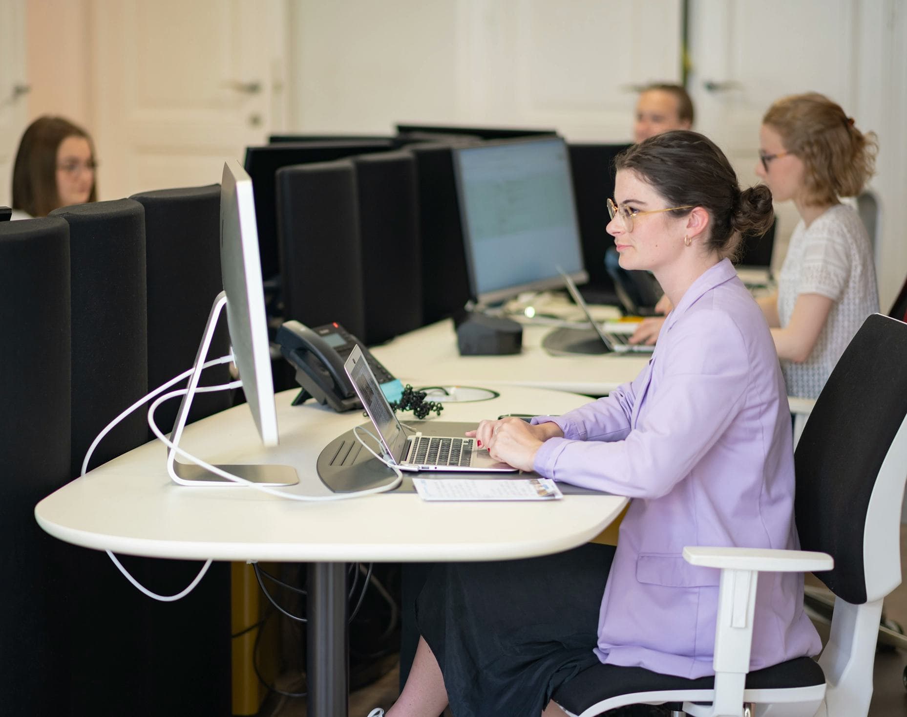 Students work on computers in class during a Student exchange programme, taking part in study and learning activities in an international setting.