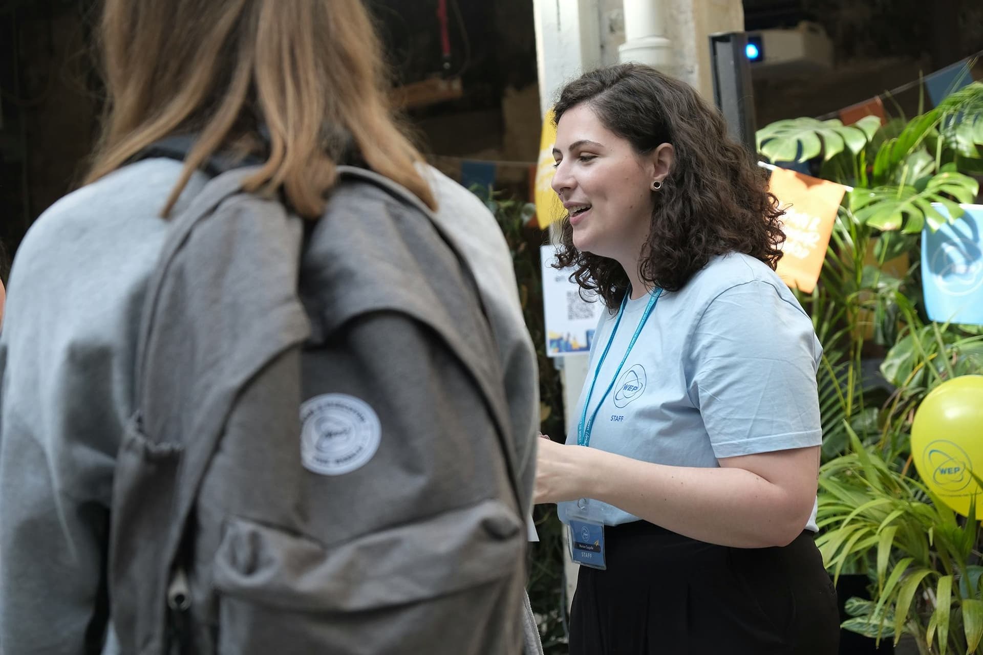 A WEP representative provides information and support to a student interested in a Student exchange programme, during a dedicated information event.